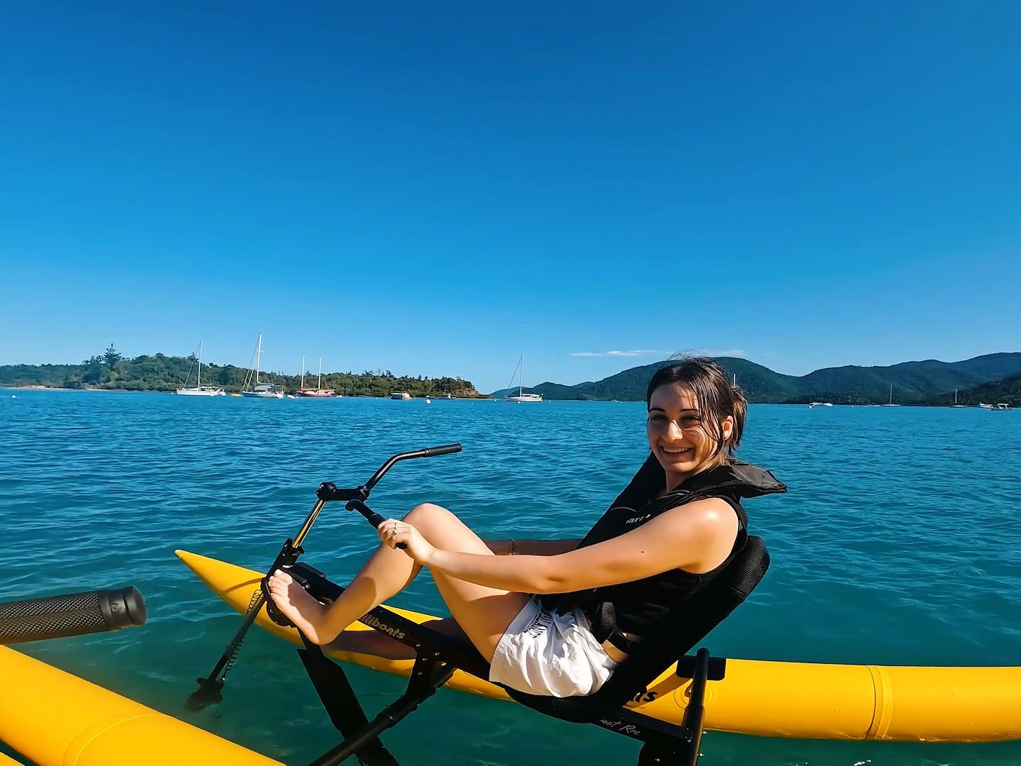 a person sitting in a boat on a body of water